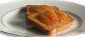 jam on rusks on white plate on the table Royalty Free Stock Photo