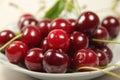 On a plate sour cherry red Royalty Free Stock Photo