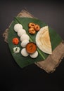 Plate of south indian food idli sambar dosa wada chutney,