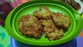 a plate of Southeast Asian food corncakes called perkedel jagung