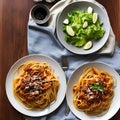 A plate of spaghetti bolognese with a side of Caesar salad2, Generative AI Royalty Free Stock Photo