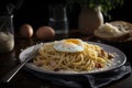 plate of spaghetti carbonara with egg and cheese, ready to be devoured