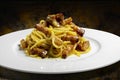 Plate of spaghetti carbonara on abstract background Royalty Free Stock Photo