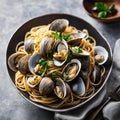 plate of spaghetti with clams and cilantro sauce