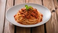 A plate of spaghetti with meat sauce and a green garnish Royalty Free Stock Photo