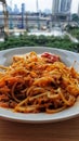 a plate of spaghetti with meat and tomato sauce