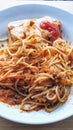 a plate of spaghetti with meat and tomato sauce
