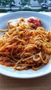 a plate of spaghetti with meat and tomato sauce