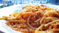 a plate of spaghetti with meat and tomato sauce