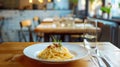 A plate of spaghetti on a wooden table Royalty Free Stock Photo