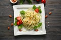Plate of spaghetti with zucchini on wooden table Royalty Free Stock Photo