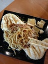 A plate of spicy noodles plus fried dumplings Royalty Free Stock Photo