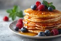 Stack of Pancakes With Syrup and Berries on a Plate Generative AI