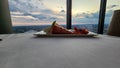 A plate of strawberry short cake with sliced strawberries on a table with a white tablecloth and a gorgeous view of the city Royalty Free Stock Photo