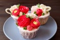 Plate of stunning flower bouquet shaped frosting cupcakes Royalty Free Stock Photo