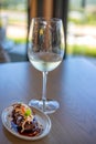 Plate of Surf and turf seafood and red meat with white wine glass Royalty Free Stock Photo