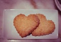 Plate with sweet baking for Valentines day. Shortbread cookies in shape of heart Royalty Free Stock Photo