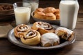 plate of sweet pastries, including cinnamon rolls and shortbread cookies, with glass of milk Royalty Free Stock Photo