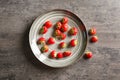 Plate with sweet ripe strawberries on table Royalty Free Stock Photo