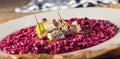 Plate of tasty beetroot risotto with cheese and aperitif Royalty Free Stock Photo