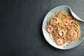 Plate of tasty buckwheat noodles with shrimps on table, top view. Space for text Royalty Free Stock Photo