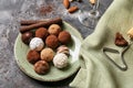Plate with tasty chocolate truffles on grey table Royalty Free Stock Photo