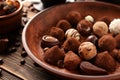 Plate with tasty chocolate truffles on table, closeup Royalty Free Stock Photo