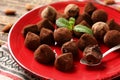 Plate with tasty chocolate truffles on table, closeup Royalty Free Stock Photo