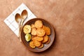 Plate with tasty cooked sweet potatoes, rosemary, sauce and spices, herbs on textured background Royalty Free Stock Photo