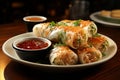 a plate of tasty crispy spring rolls with red chutney