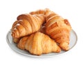 Plate with tasty croissants on white . French pastry