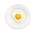 Plate with tasty fried egg in shape of heart and toast isolated on white, top view Royalty Free Stock Photo