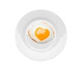 Plate with tasty fried egg with yolk in shape of heart on white background, top view Royalty Free Stock Photo