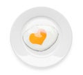 Plate with tasty fried egg with yolk in shape of heart on white background, top view Royalty Free Stock Photo