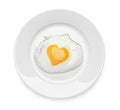 Plate with tasty fried egg with yolk in shape of heart on white background, top view Royalty Free Stock Photo