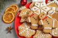 Plate with tasty homemade Christmas cookies on grey table Royalty Free Stock Photo