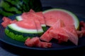 Plate with tasty sliced watermelon on table Royalty Free Stock Photo