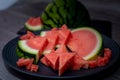 Plate with tasty sliced watermelon on table Royalty Free Stock Photo