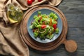 Plate with tasty vegetable salad on wooden table Royalty Free Stock Photo