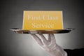 Plate With The Text First Class Service On Board Royalty Free Stock Photo