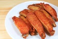 Plate of Thai Style Deep Fried Spicy Chicken Wings Royalty Free Stock Photo