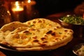 A plate of three flatbreads with a bowl of greens in the background Royalty Free Stock Photo