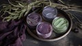 a plate with three jars of purple and green face paint