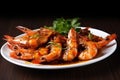 plate of tiger shrimp prawns drenched in tangy sauce