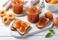 A plate of toast with apricot jam on a rustic wooden table Royalty Free Stock Photo
