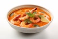 Plate of Tom Yum Goong Thai spicy prawns soup on white background