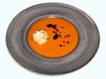 Plate of tomato-garlic soup with a cheese ball Royalty Free Stock Photo