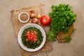 Plate of traditional Arabic salad tabbouleh on a wooden plate