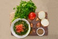 Plate of traditional Arabic salad tabbouleh on a wooden plate