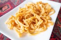 plate with traditional Armenian noodles Arishta. National folk cuisine and pasta variations concept